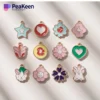 A colorful set of enamel peeken charms displayed together, showcasing their unique designs and vibrant hues.