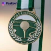 A gold golf champion medal featuring a ribbon, symbolizing achievement in the sport of golf.