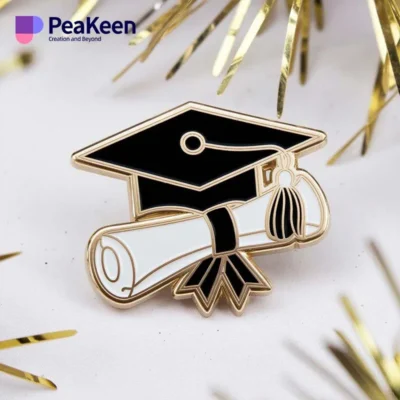 Graduation pins featuring a black and white graduation cap design, symbolizing academic achievement and celebration.