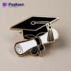 Elegant graduation pin featuring a black and gold cap, representing success and the culmination of academic efforts.