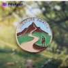 Custom enamel pin featuring a logo, designed for hiking enthusiasts, showcasing a unique and stylish accessory.