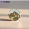A beautifully designed hiking pin depicting a mountain landscape, symbolizing the spirit of outdoor exploration.
