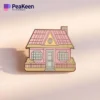 A pink house pin featuring a charming pink roof, perfect for adding a touch of color to any collection.