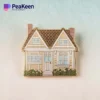 A pin featuring a simple house design, symbolizing home and comfort.