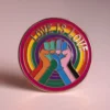 Colorful enamel pin with "Love is Love" text, representing LGBT pride and support for the community.