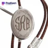 A stethoscope showcasing a monogrammed name, complemented by a matching monogram bolo tie for a cohesive appearance.