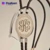 Elegant leather bracelet showcasing a custom monogram, perfect for adding a personal touch to any outfit.