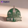 Stylish enamel pin representing New York City, ideal for adding a touch of urban flair to any outfit.