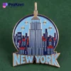A stylish pin featuring the iconic New York City skyline, showcasing its famous buildings and vibrant urban landscape.