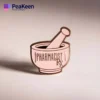 Épingle en émail rose représentant un mortier et un pilon, symbolisant la pharmacie et la pratique pharmaceutique.