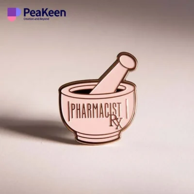 Pink enamel pin featuring a mortar and pestle, symbolizing pharmacy and pharmaceutical practice.