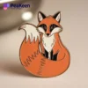 A pin featuring a vibrant orange fox design, perfect for animal lovers and pin collectors.