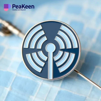 A pin featuring a radio symbol, representing the field of radiology and its significance in medical imaging.