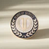 A lapel pin featuring the words "Years of Service," symbolizing dedication and commitment in professional settings.