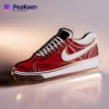 A red and white Nike shoe pin featuring the iconic logo, perfect for sneaker enthusiasts and collectors.