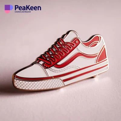 A red and white sneaker pin featuring a white sole, designed for shoe enthusiasts and collectors.