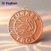 A medal inscribed with "Turkey Trot," celebrating participation in a holiday-themed race.