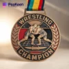 A medal inscribed with "Wrestling Champion," symbolizing achievement in wrestling competitions.