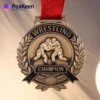 Customized wrestling championship medal featuring a unique design and engraved details for a memorable achievement.