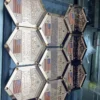 A set of six hexagon-shaped plates adorned with American flags, featuring a Wrestling Championship Belt design.