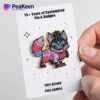 A pin badge featuring a cartoon cat design, perfect for animal lovers and collectors of unique pins.