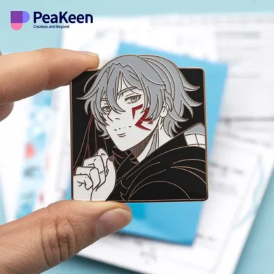 An individual holds a vibrant pin adorned with an anime character, highlighting their passion for anime merchandise.