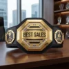 Gold best sales championship belt trophy with Quarterly Record and Annual Top Performer side plates, displayed on an executive office desk