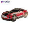 A sleek red and black sports car pin, showcasing a dynamic design that captures the essence of speed and style.