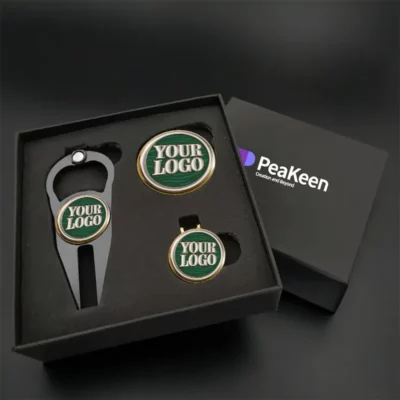 Golf gift set featuring a stylish golf ball marker and a premium golf ball, elegantly packaged in a gift box.