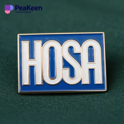 Custom logo pin badge with HOSA branding, highlighting a unique design and vibrant colors, ideal for events and recognition.