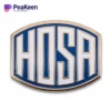 A badge featuring the word "HOSA," representing the Health Occupations Students of America organization.
