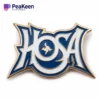Custom logo pin featuring HOSA design for a sports team, showcasing team spirit and identity in a stylish accessory.