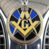 A Masonic emblem is prominently featured on a car, highlighting the significance of Freemasonry in the community.