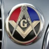 A car featuring a Masonic emblem on its front, representing the values of brotherhood and community.
