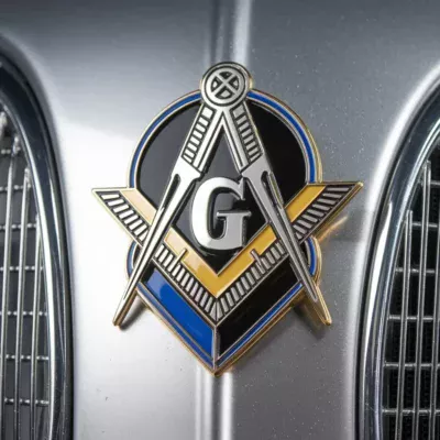 The front of a car features a Masonic emblem, representing the principles and traditions of Freemasonry.