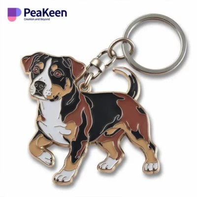 Metal keychain adorned with a black and brown dog, a charming accessory for dog owners and animal lovers alike.