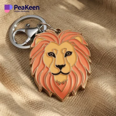 A metal lion keychain attached to a keyring, showcasing intricate details and a sleek design.