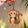 Charming soft enamel monkey keychain showcasing a brown-faced monkey, a delightful accessory for your keys or bag.