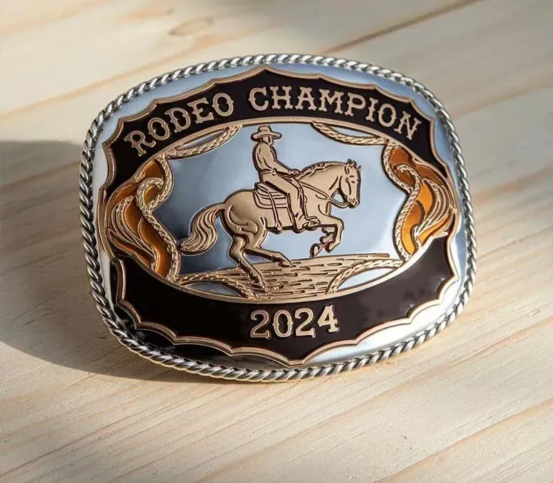 A detailed rodeo champion belt buckle featuring intricate designs and a polished finish, symbolizing victory in rodeo events.