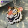 Soft enamel keychain featuring a detailed tiger face design, perfect for animal lovers and keychain collectors.