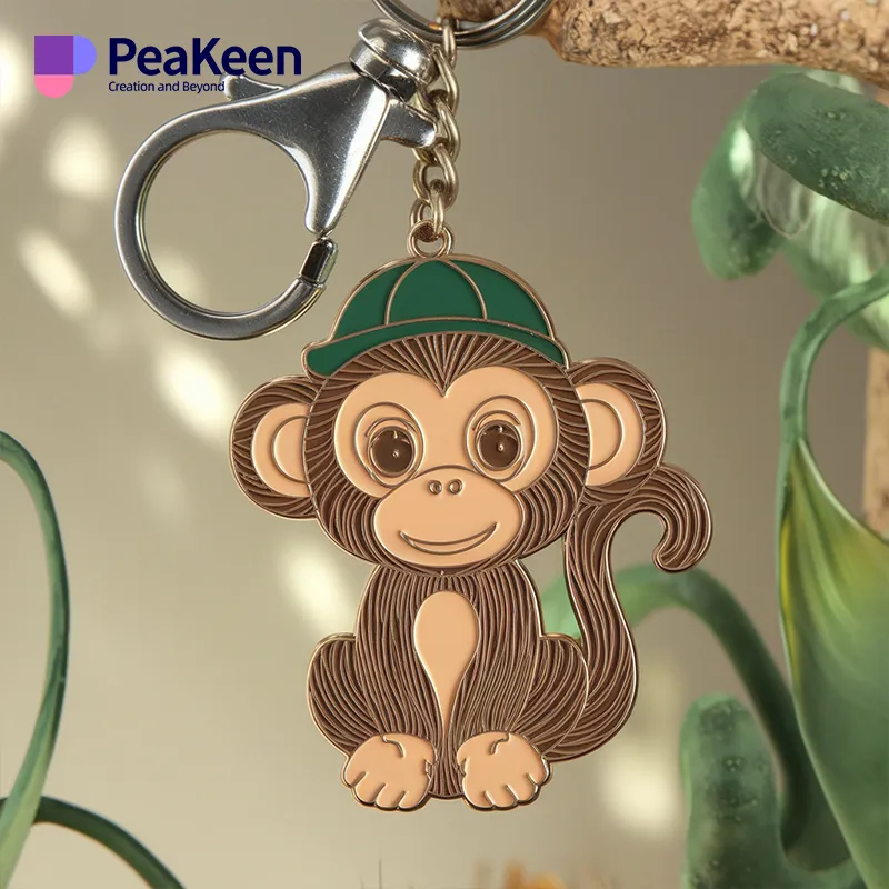 A soft enamel monkey keychain featuring a monkey wearing a green hat, showcasing a playful and colorful design.