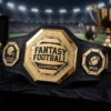 Gold fantasy football champion belt with MVP and league winner side plates displayed in a stadium setting