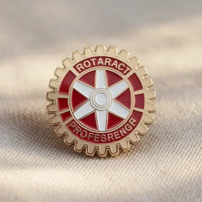 A badge featuring the words "Rotary Club," representing the Rotaract community and its values of service and fellowship.