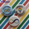 A pin badge that promotes acceptance, designed with elements that highlight autism awareness and inclusivity.