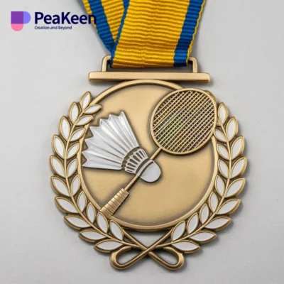 A badminton medal featuring a racket design and a colorful ribbon, symbolizing achievement in the sport.