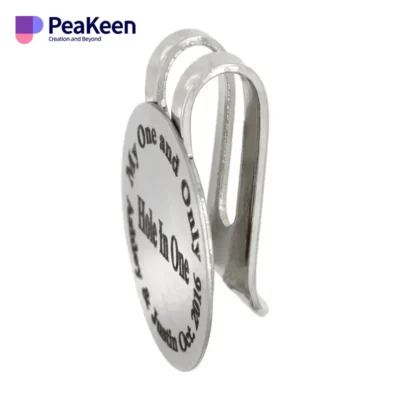 A silver metal key chain featuring the word "peaken" and a clip for a hat ball marker.