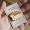A hand holding a bread pin, a tool used in baking to roll and shape bread dough.