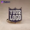 Un badge à épingle de club présentant la phrase "Votre logo" dans un format accrocheur.