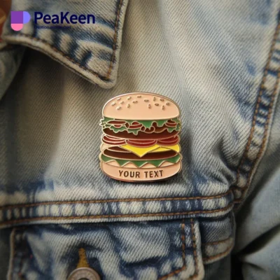 A person in a denim jacket adorned with a colorful hamburger pin, showcasing a casual and trendy style.