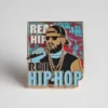 A hip hop pin featuring an image of a rapper, showcasing their style and influence in the music industry.